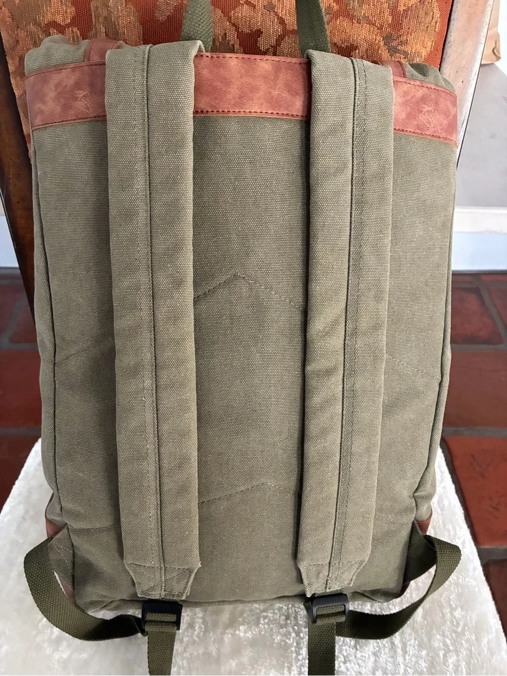 FOSTER & RYE insulated cooler wine backpack in olive green and brown.